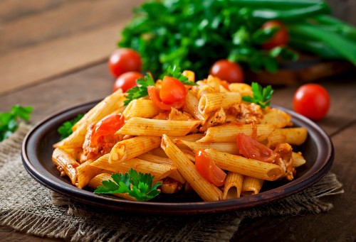 penne-pasta-tomato-sauce-with-chicken-tomatoes-wooden-table.jpg
